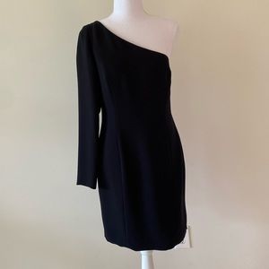 Black dress, lined and fitted with side zipper.
